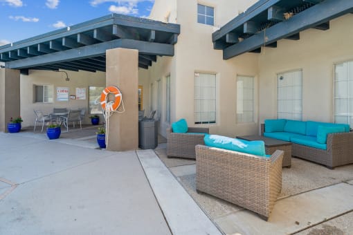 a patio with couches and chairs in front of a house at Vista Linda, Santa Fe, 87507