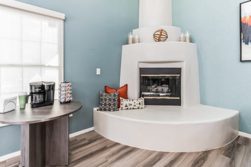 a living room with a fireplace and a coffee table at Vista Linda, Santa Fe, NM 87507