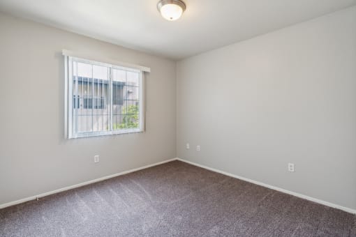 an empty room with carpet and a window at Vista Linda, Santa Fe, NM 87507
