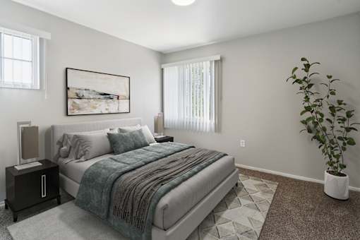 A bedroom with a bed, nightstand, and a plant.