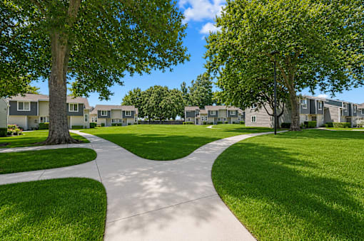 A residential area with a pathway and houses.