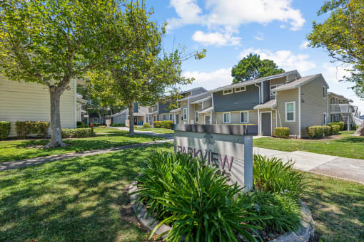 the preserve at ballantyne commons apartments exterior with trees and grass