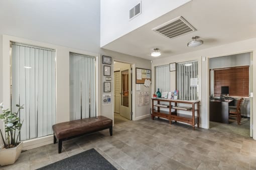 the lobby of a home with a couch and a table