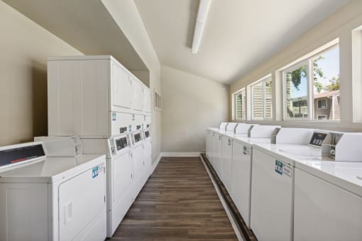 the preserve at ballantyne commons community laundry room with washes and dryers