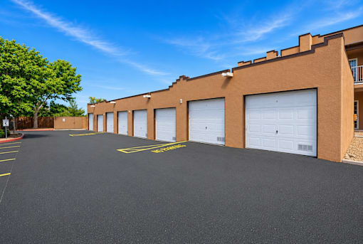 A parking lot with a building in the background.
