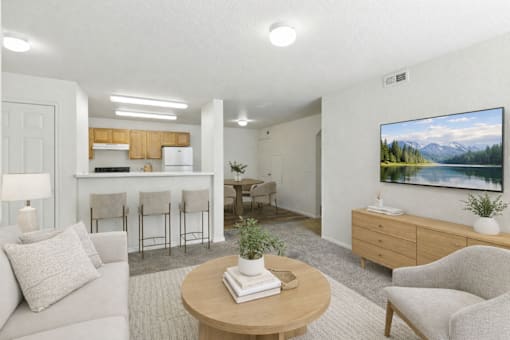 A living room with a couch, chairs, a coffee table, and a painting on the wall. at Diamond Fork Apartments, Spanish Fork, 84660