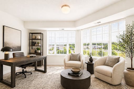 Home office with large windows and seating area at Lakewood Apartments, Lino Lakes, Minnesota