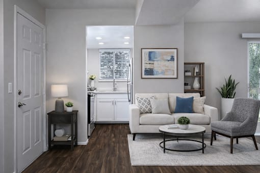 Modern living room with kitchen view at Creekview Apartments, Midvale