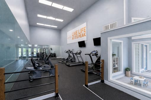 A gym with a variety of equipment and a sign at Parkland at Orange Park Apartments , Orange Park, FL, 32073