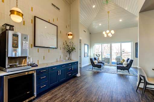 A kitchen with dark wood floors and a white ceiling.