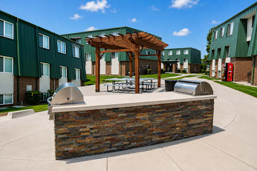 A building with a green roof and a wooden pergola at The Morgan Apartments, Utah