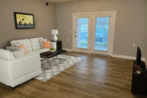 a living room with hardwood floors