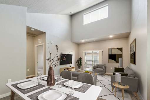 Open concept dining and living area with modern furnishings at Harper Ridge Apartments, Meridian, ID