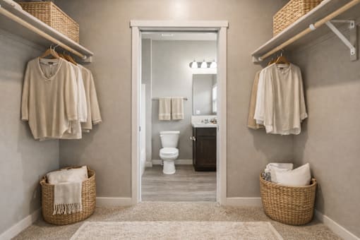 Walk-in closet with organized storage and bathroom access at Harper Ridge Apartments, Meridian