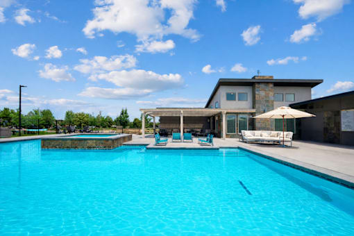 Resort style pool with covered lounge area at Harper Ridge Apartments, Meridian, 83642