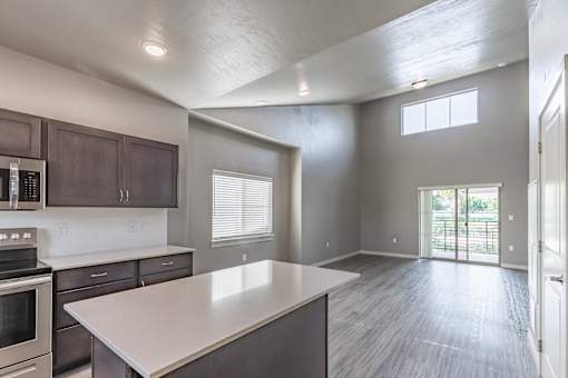 A spacious kitchen with a large island in the middle.