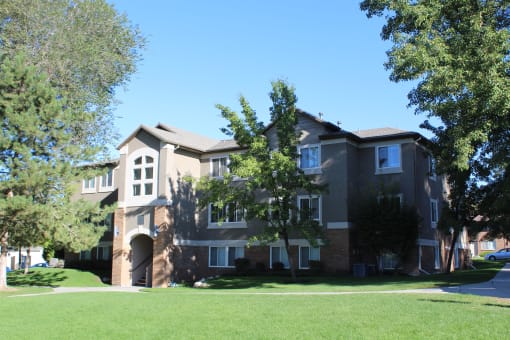 a large house with a lawn in front of it