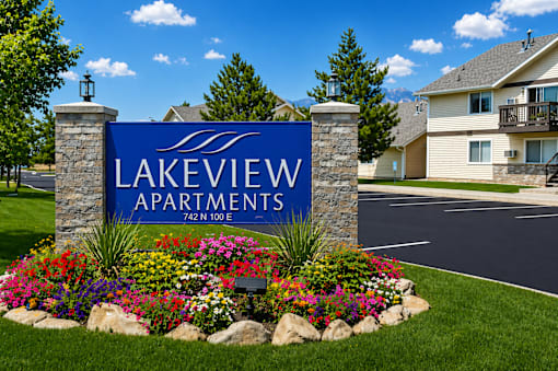 Lakeview Apartments sign with flowers in front.