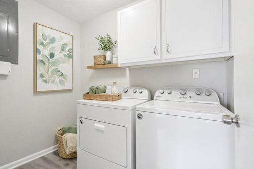 A laundry room with a washer and dryer.