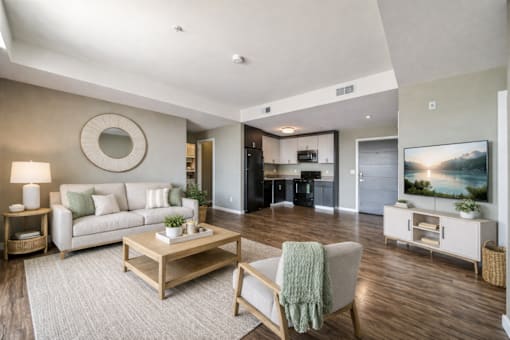 Living room with open floor plan and kitchen at Lofts at Innovation Center Apartments, Richland, WA
