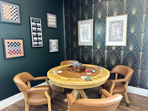 Game room with card table and wall art at Lofts at Innovation Center Apartments, Richland, WA