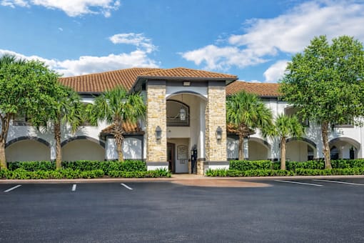 A building with a stone archway entrance and a tiled roof.