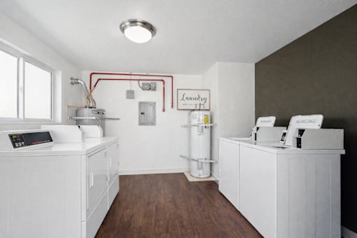 A laundry room with a washer and dryer.