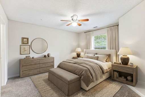 A bedroom with a bed, nightstand, and a dresser.