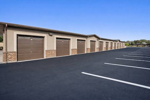 A long row of garage doors are closed.