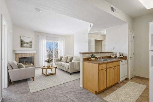 Open concept living area with modern kitchen island at Stetson Meadows Apartments, Colorado Springs, Colorado