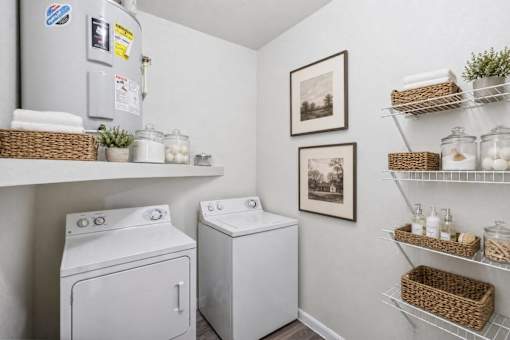 A small laundry room with a washer and dryer.