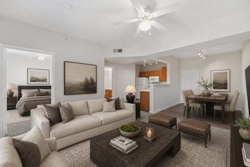 A modern living room with a large couch and a coffee table.