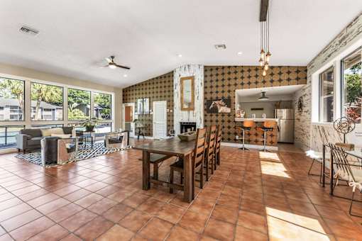A dining room with a table set for six. at Epic Apartments , Daytona Beach, FL, 32114