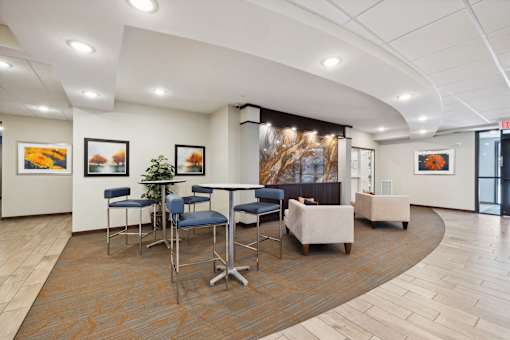A conference room with a long table and chairs.