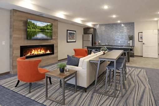 A modern living room with a fireplace and a television.
