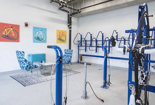 Bicycle storage and repair room with workspace at Hello Apartments, Minneapolis, Minnesota