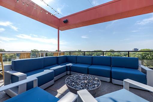 Rooftop terrace with seating and fire feature at Hello Apartments, Minneapolis, 55427