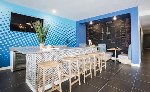 Resident bar area with tournament bracket board at Hello Apartments, Minneapolis, MN 55427