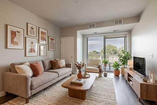 Living room with balcony and natural light at Hello Apartments, Minnesota, 55427