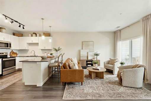 A modern kitchen with a dining area and a living room at Aster Meadow, Vadnais Heights, MN, 55127