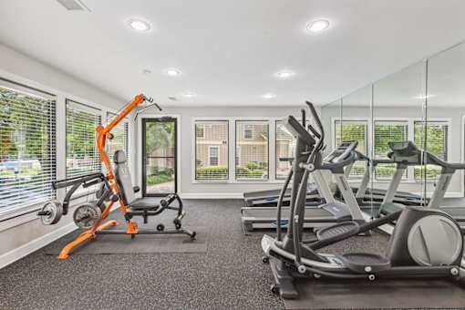 A gym with orange and black equipment.