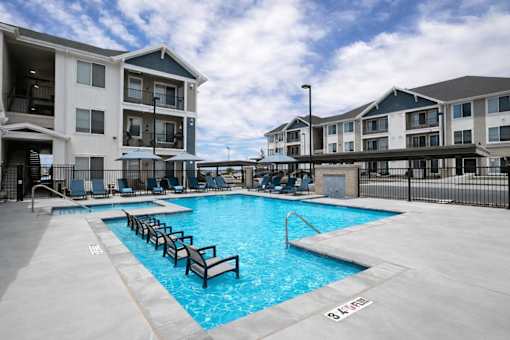 Swimming pool with sun loungers and cabana at Connect at First Creek Apartments, Colorado, 80249