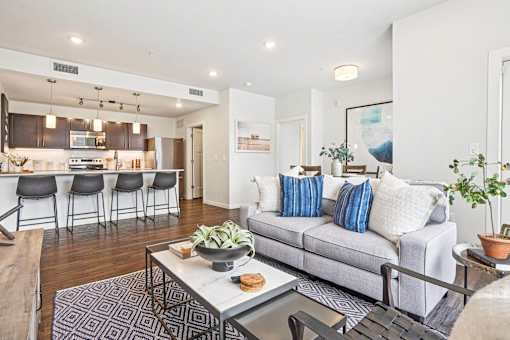 Open floor plan with kitchen and living space at Connect at First Creek Apartments, Denver, CO 80249