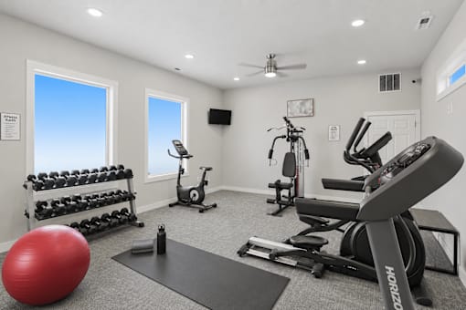 Fitness center with cardio and weight equipment at Park Station Apartments, Midvale, 84047