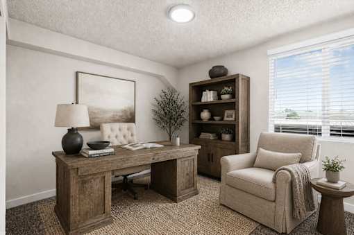 Home office with rustic wood desk and chair at Park Station Apartments, Midvale, Utah