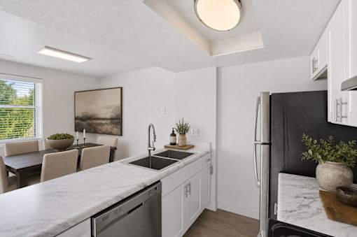 Kitchen with dining area and modern finishes at Park Station Apartments, Utah, 84047