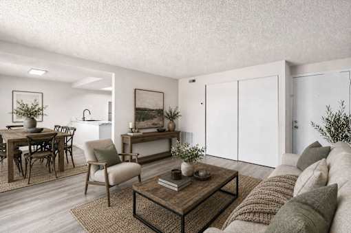 Open concept living and dining room with modern furnishings at Park Station Apartments, Midvale, UT