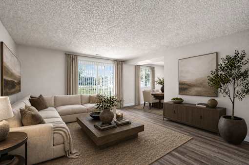 Spacious living room with large sectional sofa at Park Station Apartments, Utah