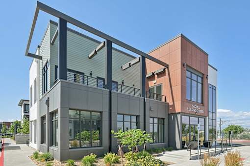 Modern leasing office with metal frame canopy at Sequel Homes Apartments, Englewood