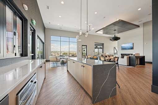 Open concept kitchen with large island at Sequel Homes Apartments, Colorado